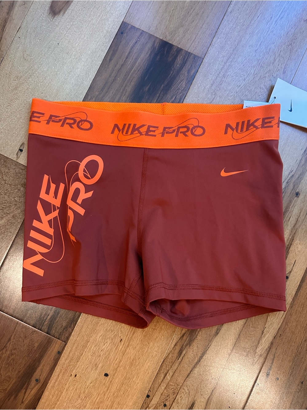 NWT Nike Pro 3" Women's Shorts M Rust Orange Dri-FIT Graphic Logo